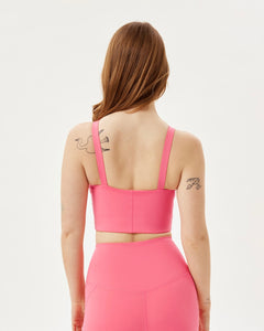 back view of the  Girlfriend Collective Mia Bra in Camellia on a model