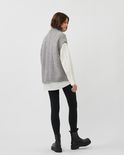 Load image into Gallery viewer, back view of the Minimum Women&#39;s Cablina Sweater Vest in Gull worn by a model standing 
