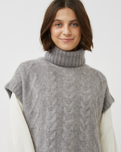 Load image into Gallery viewer, close up view of a model wearing the Minimum Women&#39;s Cablina Sweater Vest in Gull over a white long sleeve tee
