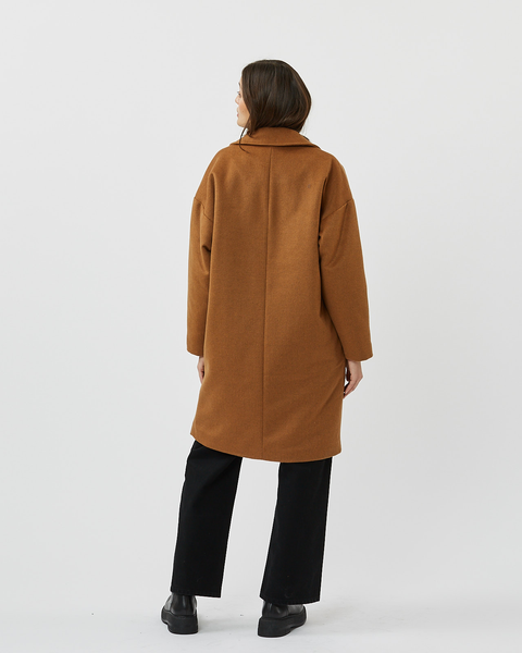 back view of model standing in the Minimum Women's Gutha Jacket in Roasted Pecan