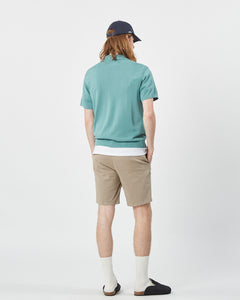 back view of the Minimum Men's Cavli Polo in Oil Blue on a model