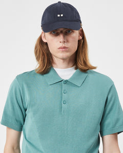 close up of the Minimum Men's Cavli Polo in Oil Blue on a model