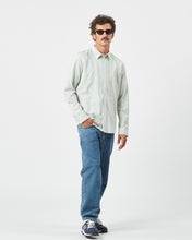 Load image into Gallery viewer, Minimum Men&#39;s Jack Shirt in Oil Blue on a model posing with his hand in his pocket
