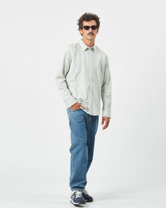 Minimum Men's Jack Shirt in Oil Blue on a model posing with his hand in his pocket