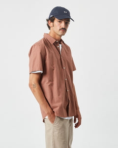 the Minimum Men's Eric Shirt in Clove on a model posing to the side
