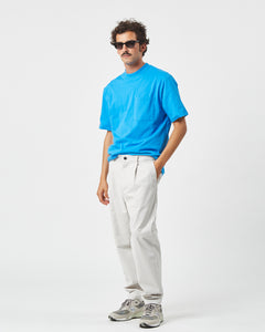 the Minimum Men's Bertils Pant in Vapor Blue on a model standing with his hand in his pocket
