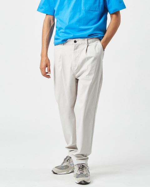 the Minimum Men's Bertils Pant in Vapor Blue on a model posing with his hand in his pocket