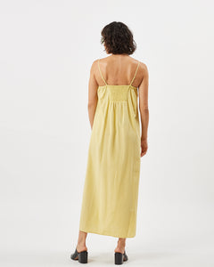 back view of the Minimum Women's Vikilino Dress in Sundress on a model