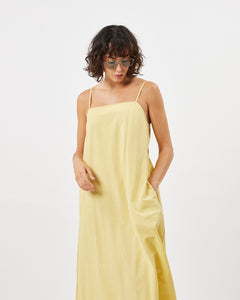 Minimum Women's Vikilino Dress in Sundress on a model looking down with one hand in her pocket
