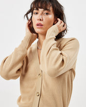 Load image into Gallery viewer, close up of the Minimum Women&#39;s Cardine Cardigan in Safari on a model posing with her hands in her hair

