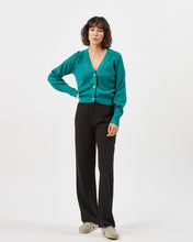 Load image into Gallery viewer, the Minimum Women&#39;s Cardine Cardigan in Bayou on a model posing with her hand on her hip

