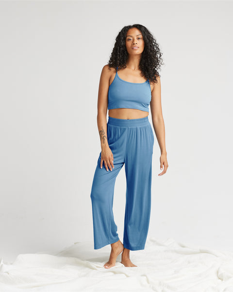model standing against a white background wearing the Richer Poorer Women's Night Knit Pant in Blue Horizon and a matching tank