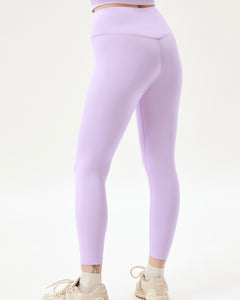 back view of the Girlfriend Collective Ultralight Crop Legging in Bellflower on a model