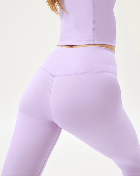 close up of the back of the Girlfriend Collective Ultralight Crop Legging in Bellflower on a model