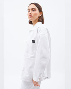 the Dr. Denim Women's Ina Jacket in White on a model posing to the side