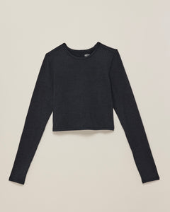the Girlfriend Collective ReSet Long Sleeve Tee in Black laying flat against a neutral background