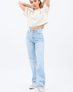 a photo of a model wearing the Dr. Denim Women's Echo Jean in Superlight Blue Jay posing with her hands in her hair