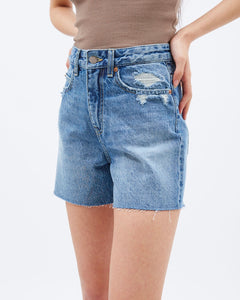 Dr. Denim Women's Nora Shorts in Drift Worn Blue shown close up on a model