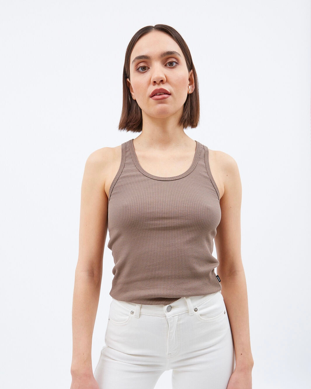 close up of the Dr. Denim Women's Demi Tank in Walnut worn by a model