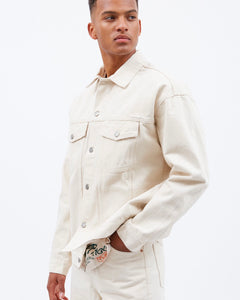 close up side view of the Dr. Denim Men's Eno Jacket in Ecru Denim on a model