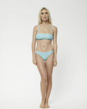 Load image into Gallery viewer, the Afends Adi Bikini in Blue Stripe on a model standing staring at the camera
