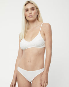 Afends Women's Lolly Bralette in White on a model