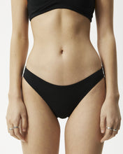 Load image into Gallery viewer, close up of a model wearing the Afends Women&#39;s Lolly Brief in Black
