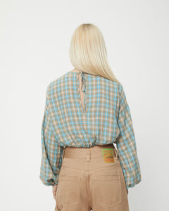 back view of the Afends Women's Millie Blouse in Tan Check on a model