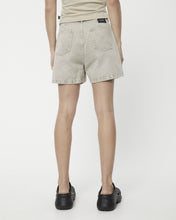 Load image into Gallery viewer, the back view Afends Women&#39;s Seventy Threes Denim Shorts in Faded Cement on a model
