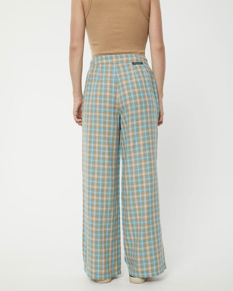 back view of the Afends Women's Millie Sienna Pant in Tan Check on a model