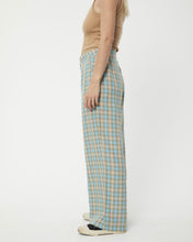 Load image into Gallery viewer, side view of the Afends Women&#39;s Millie Sienna Pant in Tan Check on a model
