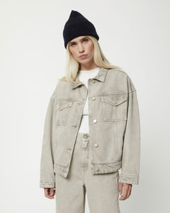 the Afends Innie Denim Jacket in Faded Cement on a model