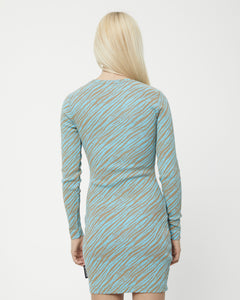 close up of the back view of the Afends Adi Rib Long Sleeve Dress in Blue Stripe on a model