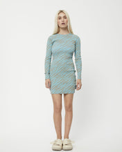 Load image into Gallery viewer, the Afends Adi Rib Long Sleeve Dress in Blue Stripe on a model standing staring into the camera
