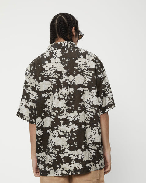 back view of the Afends Men's Short Sleeve Jungle Shirt in Earth Camo on a model