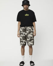 Load image into Gallery viewer, the Afends Men&#39;s Ninety Eights Short in Earth Camo on a model standing staring into the camera
