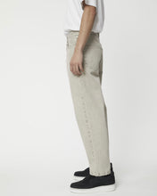 Load image into Gallery viewer, close up of the side view Afends Men&#39;s Ninety Two&#39;s Relaxed Jean in Faded Cement on a model
