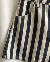 Load image into Gallery viewer, close up view of the Rolla&#39;s Women&#39;s Mirage Florence Short in Black Stripe on a hanger
