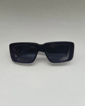 Load image into Gallery viewer, the Spitfire Cut Seventy Sunglasses in black laying on a neutral background
