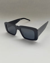 Load image into Gallery viewer, the Spitfire Cut Seventy Sunglasses in black sitting on an angle against a neutral background
