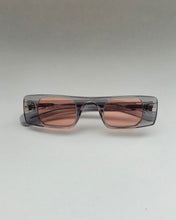 Load image into Gallery viewer, the Spitfire Cut Seven Sunglasses in grey and rose laying on a neutral background
