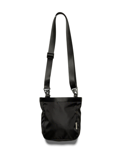 back view of the Taikan Okwa Bag in Black laying against a white background