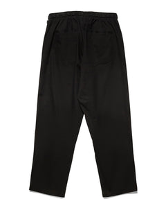 back view of the Taikan Chiller Pant in Black Twill on a white background