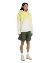 Load image into Gallery viewer, the Taikan Nylon Shorts in Forest Green worn by a model standing with her hands near her sides
