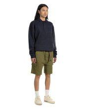 Load image into Gallery viewer, the Taikan Cargo Shorts in Olive worn by a model standing with her hands by her sides
