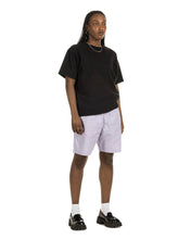 Load image into Gallery viewer, the Taikan Heavyweight T-Shirt in Black Acid on a model standing at an angle
