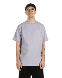 the Taikan Heavyweight T-Shirt in Lavender worn by a model looking into the camera