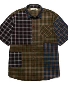 the Taikan Patchwork Shirt in Olive Plaid laying flat on a white background