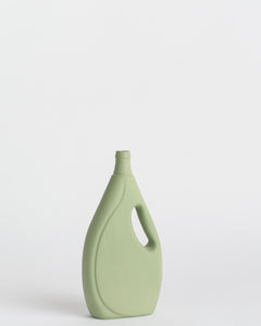 Middle Kingdom Laundry Detergent Vase in sage against white background turned on an angle