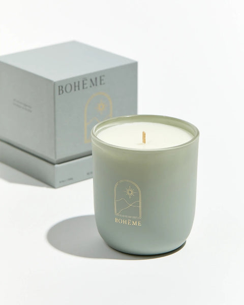 Boheme Fragrances Istanbul Candle sitting in front of it's box on a white surface